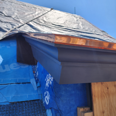 Blue tarp on roof under construction Blue tarp on roof under construction