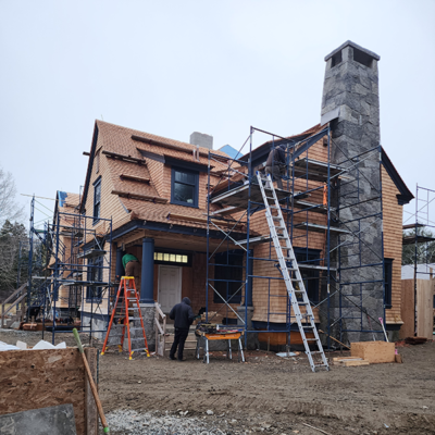 Gray chimney house under construction. Gray chimney house under construction.