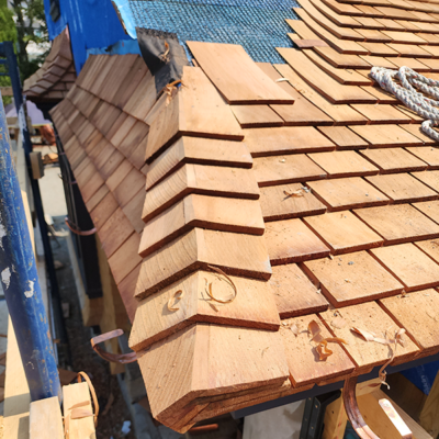 Shake roof under construction. Shake roof under construction.