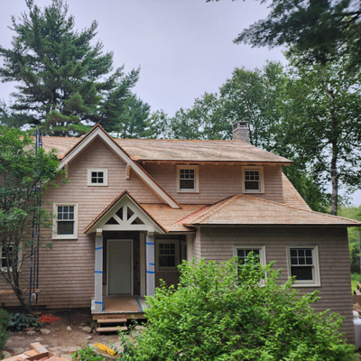 Tan house in forest. Tan house in forest.