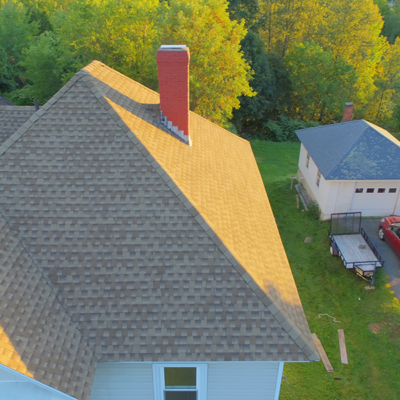 Top view of house with orange chimney. Top view of house with orange chimney.