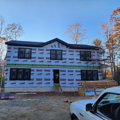 White plastic on house under construction. White plastic on house under construction.